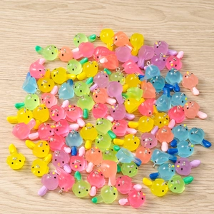 Mix of colorful translucent bird-shaped resin charms with silver metal jump rings