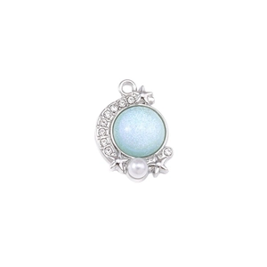 Silver star and crescent moon pendant with light blue cat eye stone and pearl detail