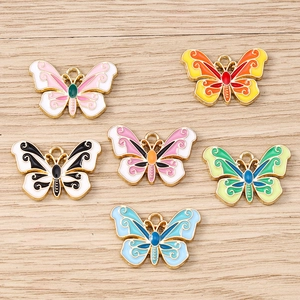 Set of ten colorful enamel butterfly charms with gold-plated edges for DIY jewelry making