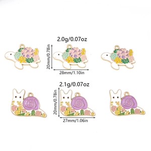 Detailed macro view showing snail and turtle enamel charms with precise measurements