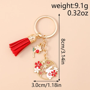 Detail view of rabbit tassel keychain with dimensions 8cm height and 3cm pendant diameter