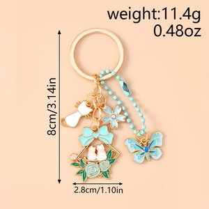 Dettaglio portachiavi con coniglio e fiori dorati con dimensioni e specifiche peso