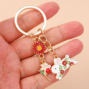 Fashionable floral rabbit keychain with sunflower charms and polished gold metal ring