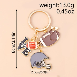 Detailed view of rugby themed keychain with black love plate and mini helmet charm