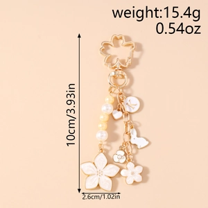 Detailed view showing cherry blossom keychain dimensions and rabbit charm design