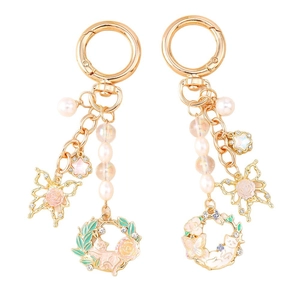 Exquisite golden butterfly and pearl keychain set with floral enamel charms and stars