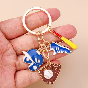 Golden keychain with baseball bat, helmet, sneaker and catcher glove enamel charms