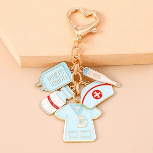Detail of medical nurse keychain with heart clasp, drip bag and thermometer charms
