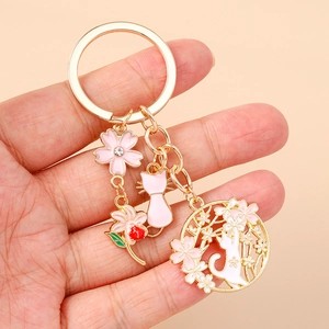 Portachiavi gatto fiori di ciliegio giapponese in lega d'oro con strass rosa