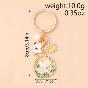 Détail d'un porte-clés style chinois avec oiseau, rose, perle et breloque fleurie