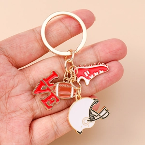 Rugby theme keychain with football, helmet, love charm, and sneaker enamel pendants