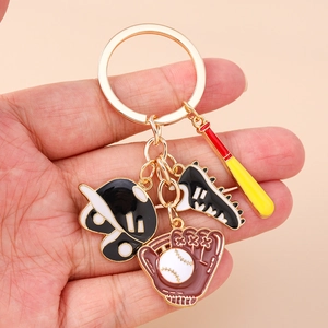 Close-up of baseball themed keychain with bat, helmet, glove, and cleat charms