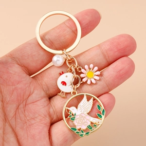 Porte-clés de style chinois avec pigeon en émail, couronne florale et perle à la main