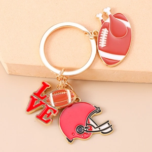 Detail of American football keychain with red LOVE charm and helmet pendant charms