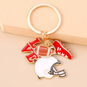 Detail showing rugby themed keychain with LOVE charm, helmet and miniature ball