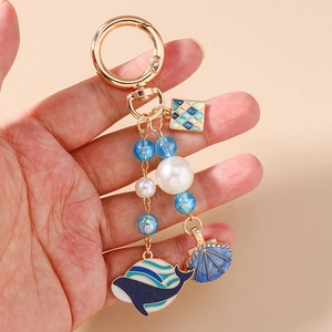 Porte-clés baleine et coquillage de mode avec émail bleu et perles blanches