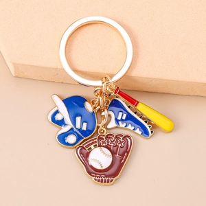 Detail of baseball keychain set with metal helmet, bat, and glove charms on gold ring