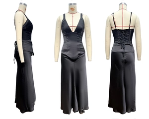Detail view of black satin evening dress showing V-neck and lace-up corset back design