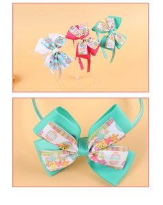Detailed macro view of Easter grosgrain ribbon bow headbands with rabbit and egg prints