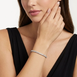 Elegant S925 sterling silver tennis bracelet with round cut moissanite on a female wrist