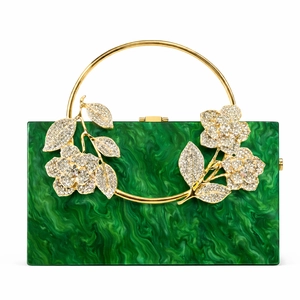 Detailed macro view of green marble acrylic evening bag with gold floral rhinestone decor