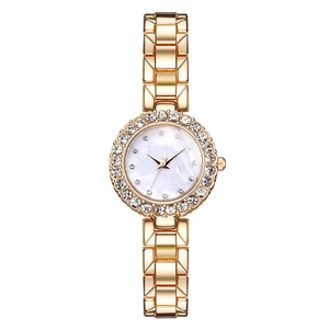 Macro detail of fashionable women's watch with rhinestone bezel and metal chain strap