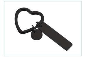 Close-up of matte black stainless steel heart keyring with blank square and round tags