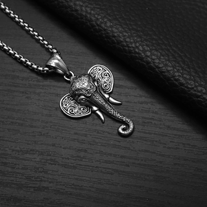 Detailed close-up of retro elephant head pendant on a square link chain for men