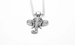 Macro view of vintage stainless steel elephant pendant with detailed engraving