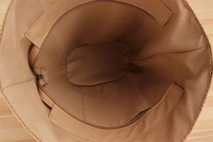 Detailed macro view showing the spacious inner compartment with zipper and slip pocket