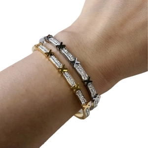 Elegant gold and silver stainless steel X bangle bracelets with sparkling crystal pavé