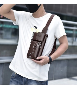 Detail view of deep brown pebbled PU leather surface and metal hardware on men's chest bag