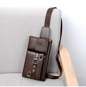 Close-up of dark brown leather crossbody bag featuring silver zippers and embossed logo