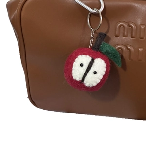 Handmade red apple wool felt keychain accessory for bags with realistic fruit texture