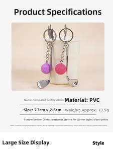 Detail view of golf club keychains in pink and purple colors hanging on a cup