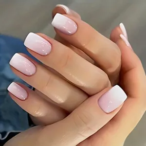 Detailed view of French gradient press-on nails with soft pink to white transition
