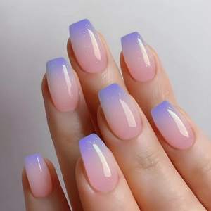 Detail of pink-purple gradient long coffin press-on nails with fine glitter finish