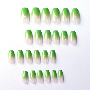 Detail view of 24 pieces of green gradient coffin press-on nails with a glossy finish