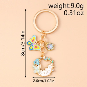Detailed size view of floral cat keychain with enamel butterfly and gold-tone ring