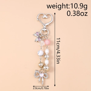 Detailed view of beaded keychain with lavender bow, pink star beads, and heart clasp