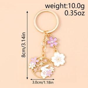 Detail view of rabbit and cherry blossom keychain with size dimensions and measurements