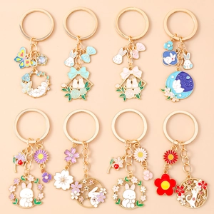 Exquisite enamel animal keychains featuring rabbit, cat and flower patterns in gold alloy