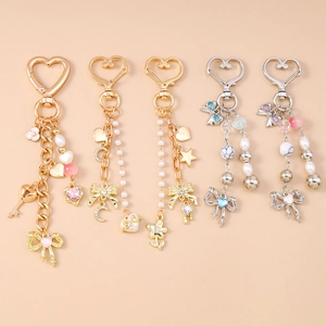 Chic set of five beaded bow keychains with diamond moon and heart pendants for bags
