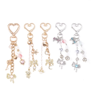 Star and bowknot keychain charms with colorful beads and heart-shaped hooks for bags