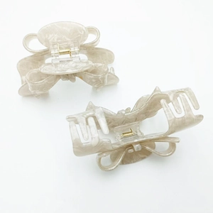 Elegant marble-textured PVC bow hair claw clips for women with strong metal spring