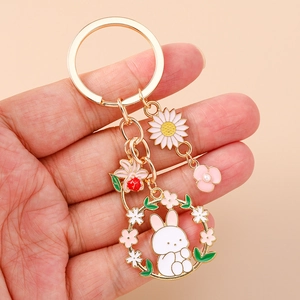 Handheld gold enamel rabbit floral keychain set with pink flower and beetle charms