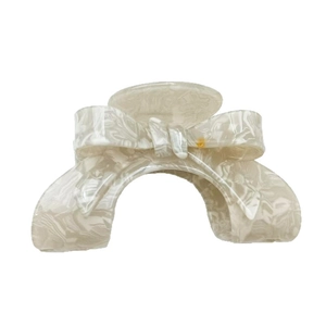Elegant cream marble patterned acetate bow hair claw clip for French style updo hairstyles