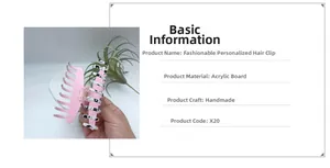 Detail of handmade pink acrylic hair claw with black and white spotted patterns