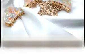 Detail of colorful acetate heart hair claw clip with golden metal spring and marble texture