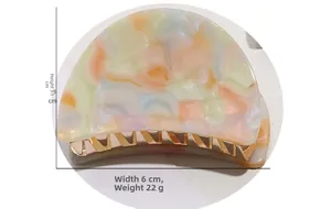 Detailed size view of a 6cm marble texture acetate hair claw clip with golden metal teeth